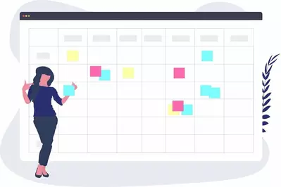 woman making a calendar using colorful sticky notes