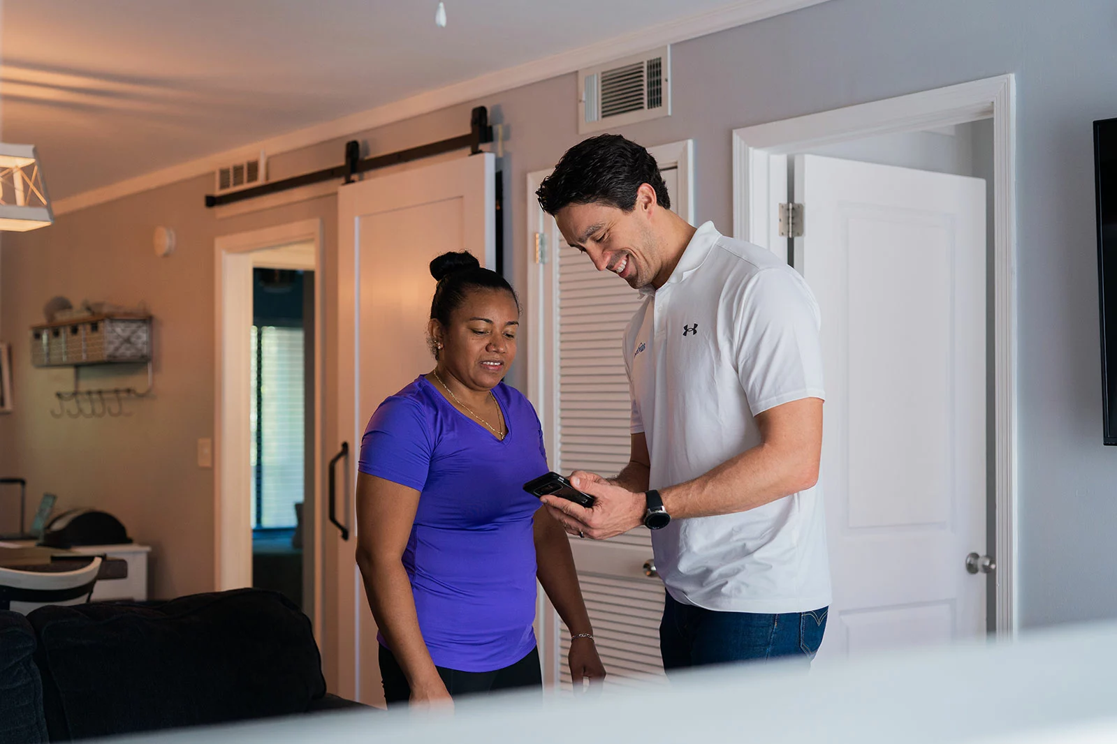 Man and women looking at phone