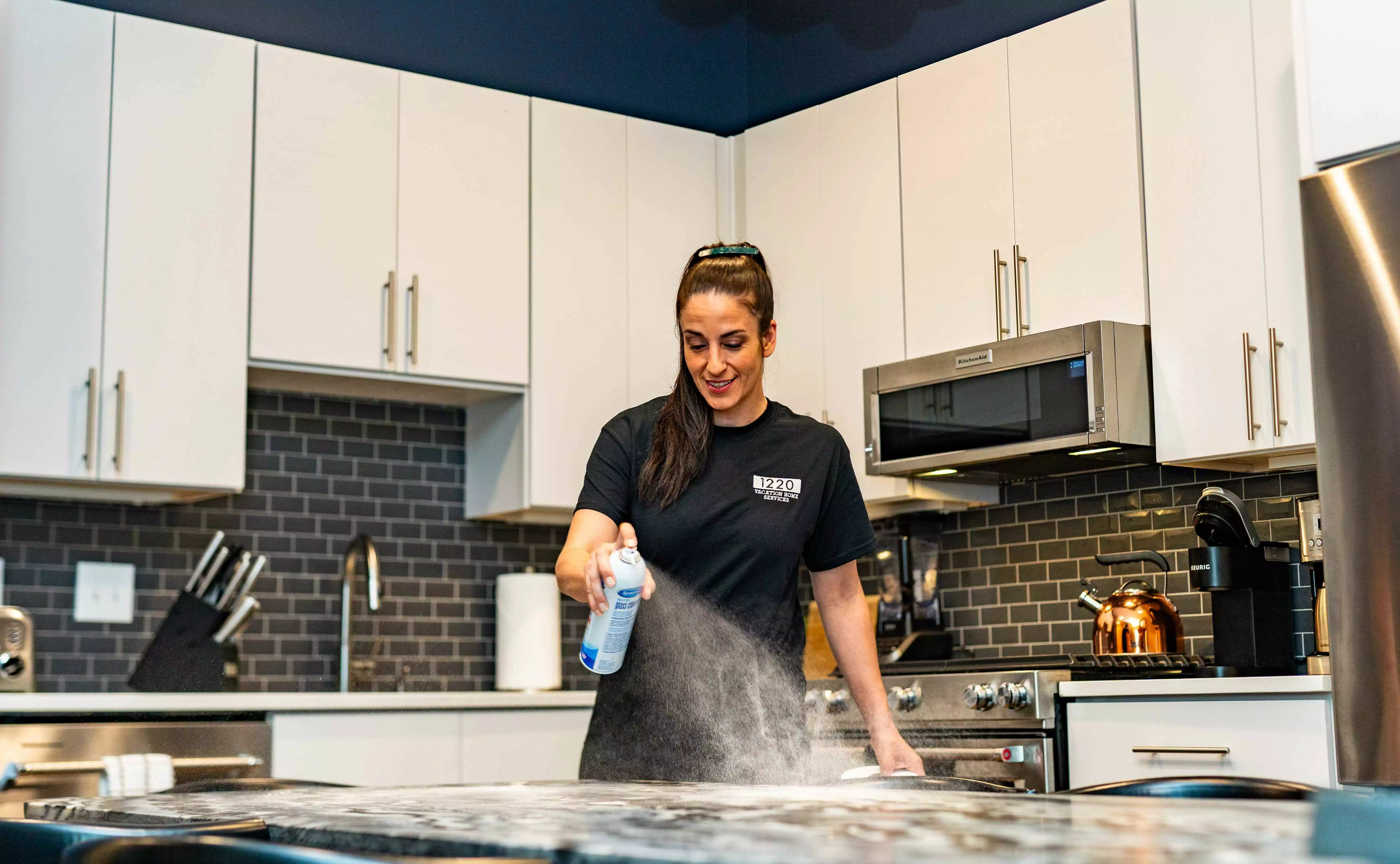 Women cleaning countertop