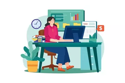 female bookkeeper working at computer desk surrounded by charts and tax documents