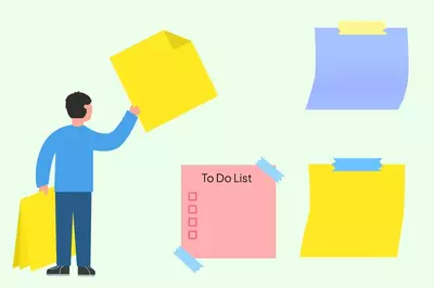 man removing sticky notes from wall with To-Do Lists