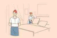 housekeepers making bed